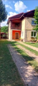 a large house with a pathway in front of it at Casa Edan Breaza in Breaza