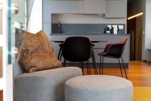 a living room with a couch and two chairs at Grand Hotel Torre Fara in Chiavari