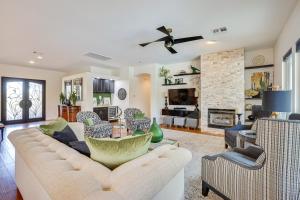 a living room with a couch and a fireplace at Day Trip to Dtwn Phoenix Peoria Retreat with Pool in Peoria