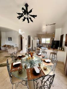 a dining room and kitchen with a table and chairs at GS 23 in Hurghada