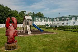 a park with a playground with a slide at Acadia Inn in Bar Harbor