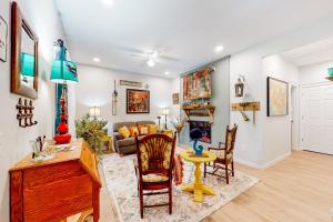 a living room with a table and chairs at NOLA on Main in Eureka Springs