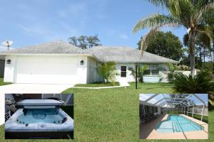 a house with a swimming pool and a palm tree at HIDDEN OASIS Spacious Pool Home with Florida Room and Hot Tub in Palm Coast