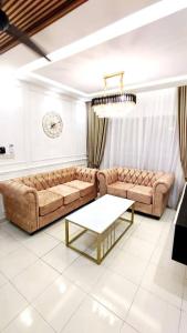 Uma área de estar em Luxury Suite Alanis Residence Sepang KLIA1 KLIA2 Putrajaya Cyberjaya