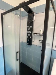 a shower with a glass door in a bathroom at Alle porte di Torino in Moncalieri