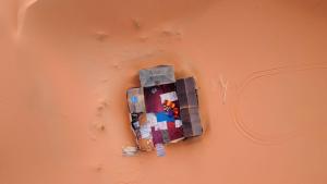 a lego toy is hanging on a wall at Gambi Camp in Adrouine
