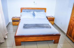 Postel nebo postele na pokoji v ubytování LES LOGIS DE NOUVELLE ROUTE BASTOS