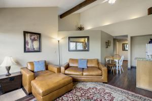 a living room with a couch and a chair at Country Club Condo in Flagstaff in Flagstaff