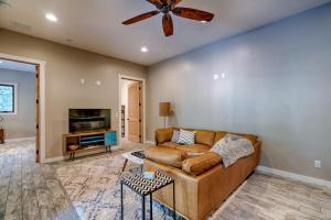 a living room with a couch and a ceiling fan at The Chic Cabin Apartment in Flagstaff