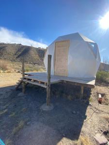 a tiny house sitting on top of a trailer at Domos Andinos HostCamp in Potrerillos