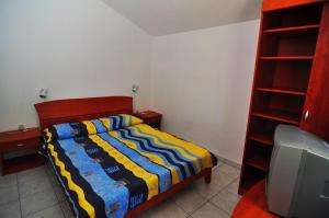 Łóżko lub łóżka w pokoju w obiekcie Apartments Livia