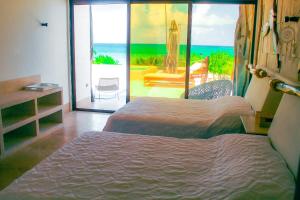 Postel nebo postele na pokoji v ubytování Therasia Luxury beachfront retreat + 39 fotografií