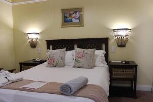 Royal Guest House tesisinde bir odada yatak veya yataklar
