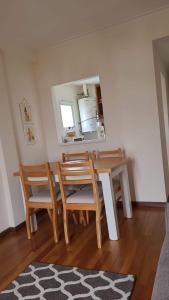 a dining room with a table and chairs at Chacabuco Centro Apartment in Tandil +3 photos