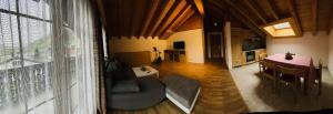 a living room with a table and a dining room at Sternen B&B & Ristorante in Elm