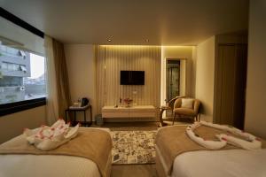 Letto o letti in una camera di Gold's Pyramids Hotel