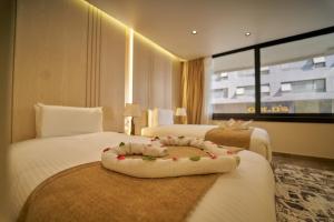 Letto o letti in una camera di Gold's Pyramids Hotel