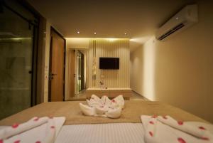 Letto o letti in una camera di Gold's Pyramids Hotel