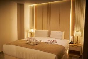 Letto o letti in una camera di Gold's Pyramids Hotel