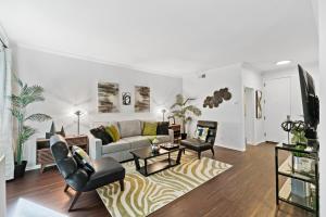 a living room with a couch and chairs at Beverly Hills Gem 1 BR Apt with Parking 218 in Los Angeles