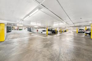 a parking garage with cars parked in it at Beverly Hills Gem 1 BR Apt with Parking 218 in Los Angeles