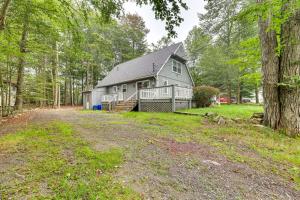 a large house in the middle of a forest at 5 Mi to Tobyhanna State Park Home with Game Room! in Tobyhanna