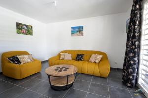 Istumisnurk majutusasutuses L'Anse Plage appartement 2 chambres avec spa à 200 m de la plage, jardin Privé et Parking