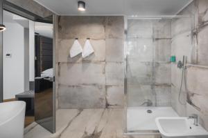 Ein Badezimmer in der Unterkunft Hotel Cittar
