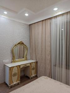 a dressing table with a mirror on it next to a window at Tevosyan EVN Airport in Pʼarakʼar