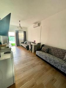 a living room with a couch and a table at Apartman K2 in Kraljevo