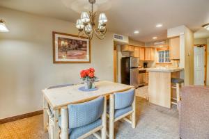 a kitchen and dining room with a wooden table and chairs at Icicle Village Resort 401 Aspen Abode in Leavenworth