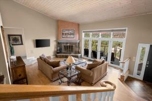 a living room with two couches and a fireplace at Oak Ridge at Palisades in Sedona