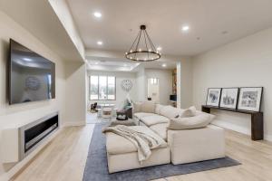 a living room with a couch and a fireplace at Parkway Paradise in Scottsdale