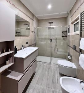 a bathroom with a shower and a sink and a toilet at Lady Luxury Apartment in Bari +22 photos