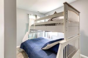 a bedroom with a bunk bed and a ladder at Waterfront Burgaw Vacation Rental with Private Yard! in Burgaw
