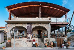 a building with awning on top of it at Vilaeti Dimitra in Agios Konstantinos