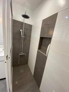a bathroom with a shower with a sink and a shower at Residência Azevedo in Câmara de Lobos +40 photos