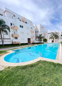 a large swimming pool in front of a building at The Paradise of ACHAKAR in Tangier