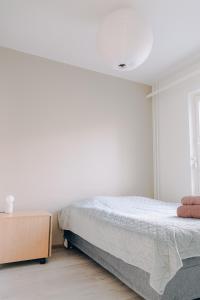 Postel nebo postele na pokoji v ubytování Nordic sauna apartment in center