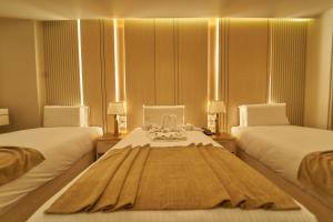 Letto o letti in una camera di Gold's Pyramids Hotel
