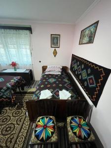 a bedroom with a bed in a room at CASA LUCIAN in Cîrţişoara