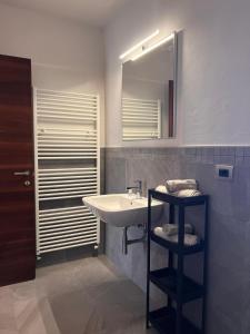 a bathroom with a sink and a mirror at Cà di Gat in La Morra +20 photos