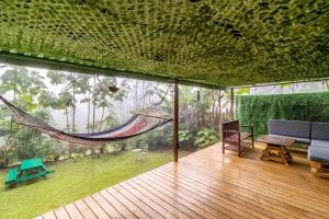 a hammock in the middle of a living room at Tiny house Monteverde in Monteverde Costa Rica