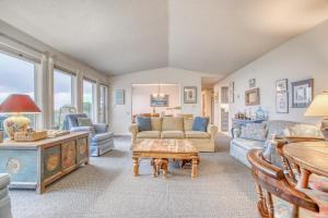 a living room with a couch and a table at Sandpiper Retreat in Waldport