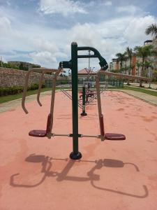 a monkey bars on a playground in a park at Pool Breeze 202 in Punta Cana