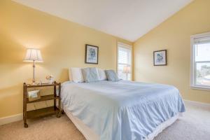 a bedroom with a large bed and a window at Ocean Gem in Lincoln City
