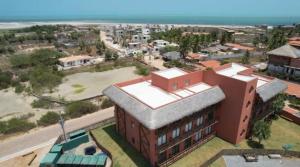 an overhead view of a building with the ocean in the background at Concept Studios Barrinha in Barra Grande