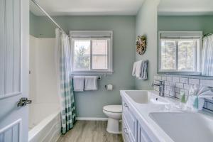 a bathroom with a sink and a toilet at Captains Quarters in Lincoln City +65 photos