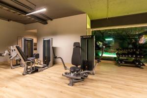 a gym with treadmills and elliptical machines at Dominion Polanco in Mexico City