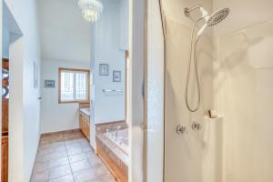 a bathroom with a shower and a sink at SeaCret Hideaway in Lincoln City +63 photos